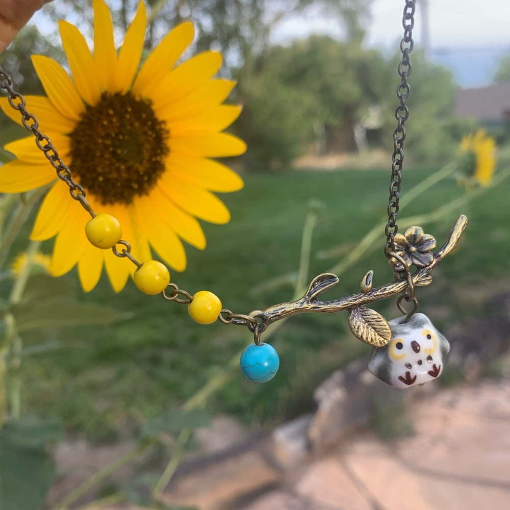 Porcelain Owl, Gun Metal Necklace w/beads.